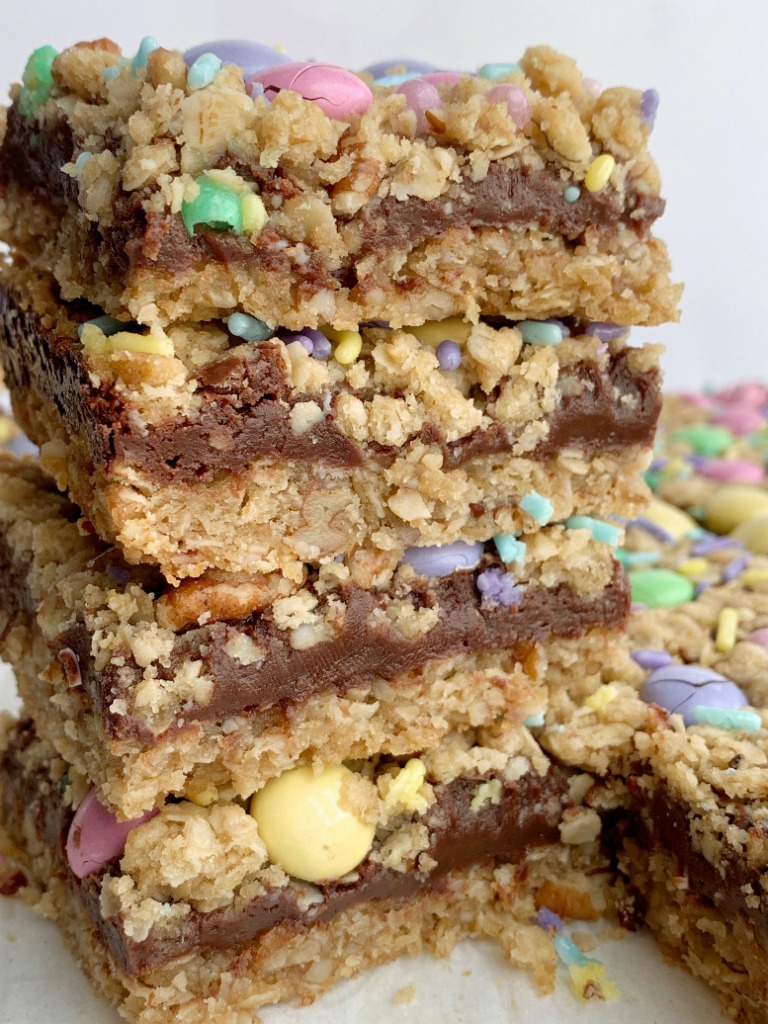 Easter Goody Bars | Goody Bars | Easter Recipe | Easter Goody Bars are the perfect springtime treat! A pecan and oat crumble mixture for the crust, filled with a creamy fudge filling, topped with more crumble and Easter m&m candy and sprinkles. #easter #easterrecipes #dessert #dessertrecipes #recipeoftheday #holidayrecipes