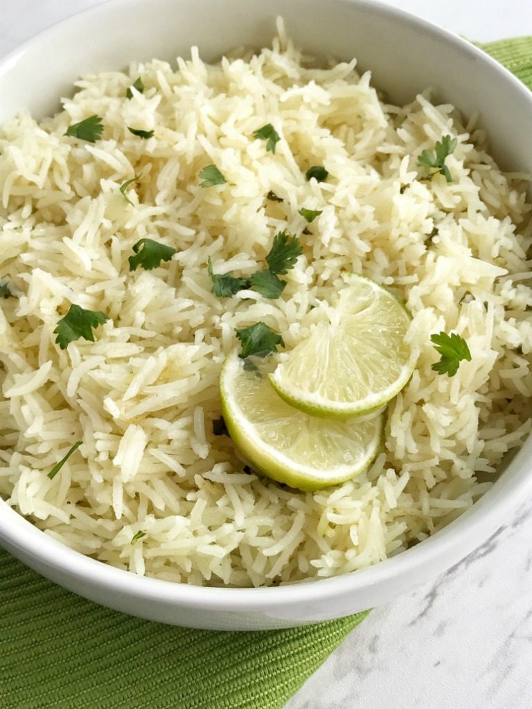 Cilantro lime rice is the perfect side dish, for burritos, nachos, or even a taco salad. So many options! Delicious toasted rice is cooked to perfection in a flavorful chicken broth full of spices, cilantro and lime. This is the best cilantro lime rice and turns out perfect every single time.