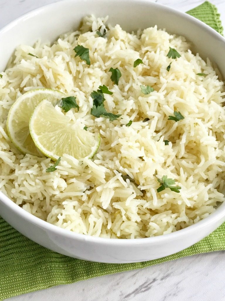 Cilantro lime rice is the perfect side dish, for burritos, nachos, or even a taco salad. So many options! Delicious toasted rice is cooked to perfection in a flavorful chicken broth full of spices, cilantro and lime. This is the best cilantro lime rice and turns out perfect every single time.