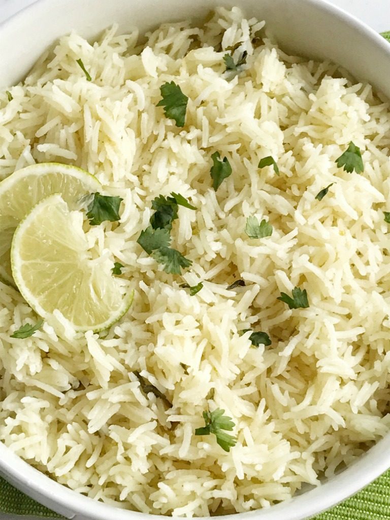 Cilantro lime rice is the perfect side dish, for burritos, nachos, or even a taco salad. So many options! Delicious toasted rice is cooked to perfection in a flavorful chicken broth full of spices, cilantro and lime. This is the best cilantro lime rice and turns out perfect every single time.