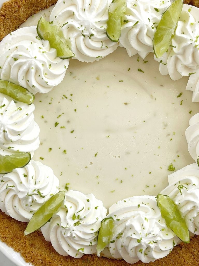 Overhead picture of key lime pie inside a 9-inch pie plate.