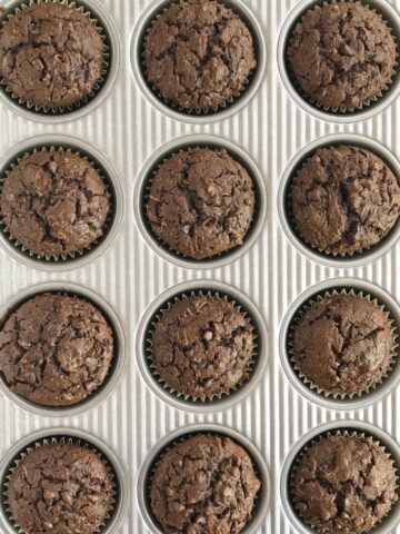 Chocolate Zucchini Muffins | Chocolate zucchini muffins are loaded with chocolate, chocolate chips and plenty of zucchini! Shredded zucchini makes these chocolate muffins so moist and crazy delicious. #muffins #chocolate #easyrecipes