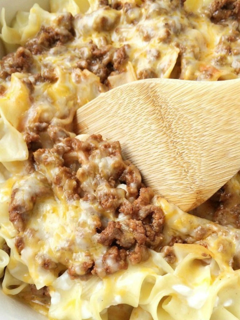 Tender egg noodles, melty cheese, and a creamy tomato ground beef mixture make for one amazing, and family-friendly dinner! The entire family will love this simple and easy creamy beef noodle bake.