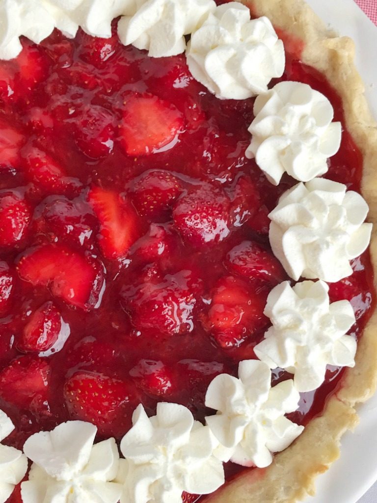 Fresh strawberry pie is loaded with lots of fresh strawberries covered in an easy, homemade strawberry gelatin. No Jell-O mixes required! Serve with some freshly whipped cream and you have a lighter dessert that is perfect for summer!
