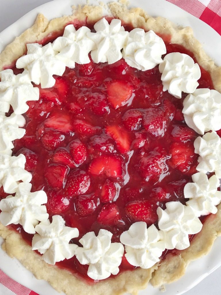 Fresh strawberry pie is loaded with lots of fresh strawberries covered in an easy, homemade strawberry gelatin. No Jell-O mixes required! Serve with some freshly whipped cream and you have a lighter dessert that is perfect for summer!