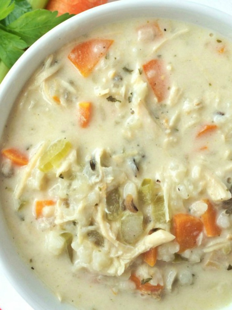 Creamy chicken wild rice soup is a family favorite for chilly days. Creamy, flavorful broth loaded with shredded chicken, carrots, celery and wild rice. This cooks all day in the slow cooker and uses a package of rice-a-roni for convenience. This stuff is incredible!