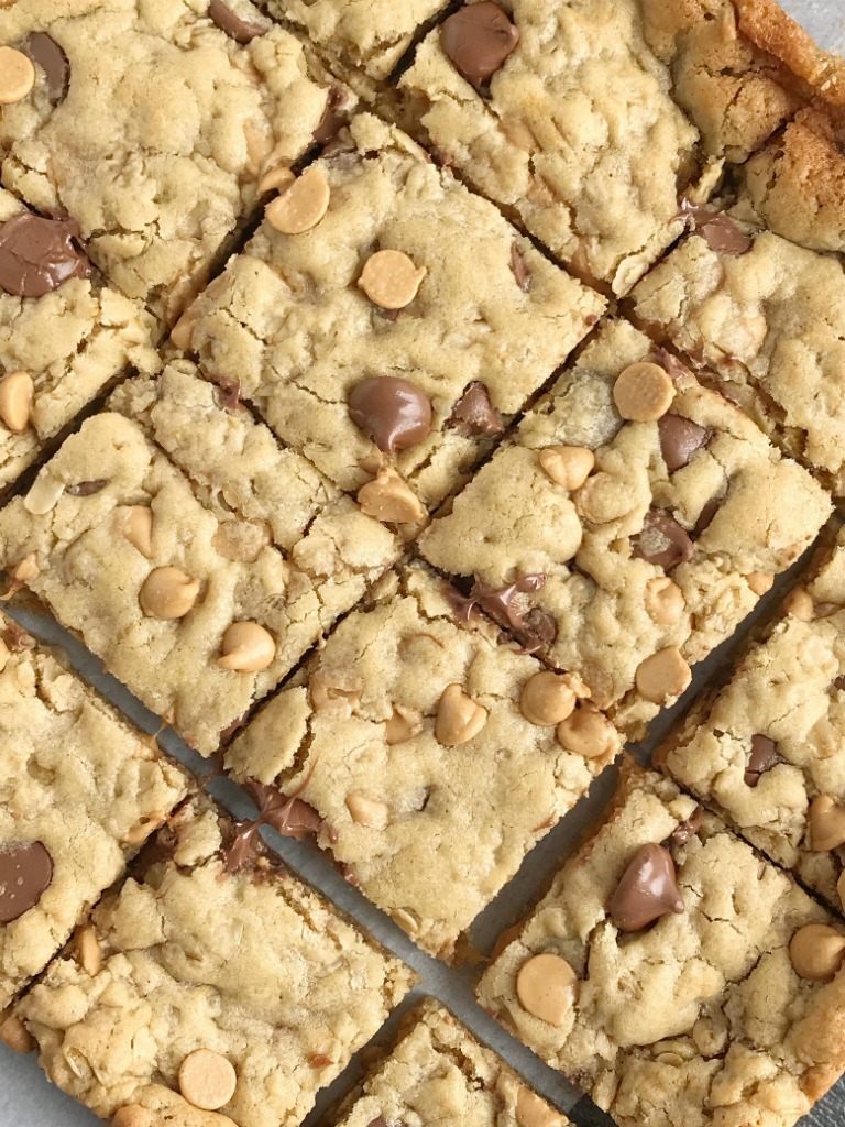 Oatmeal Chocolate Chip Peanut Butter Bars | Oatmeal chocolate chip peanut butter bars are a family favorite dessert that everyone loves. Soft cookie bars loaded with oatmeal, peanut butter, peanut butter chips, and chocolate chips. Everyone loves these soft-baked cookies bars. #easydessertrecipes #dessert #peanutbutter #chocolate