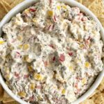 Vegetable ranch cracker dip is filled with corn, olives, red pepper, cream cheese, and ranch seasoning mix! So creamy, easy to make, and packed with flavor. Great for a bbq, party, or appetizer.  