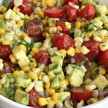 Avocado Corn Tomato Salad | Side Dish | Avocado | Healthy Recipe | Avocado Corn Tomato Salad is an easy, light, and refreshing salad! Chunks of avocado, sliced tomato and frozen corn are covered in an easy lime & olive oil dressing. Simple ingredients with amazing taste. Perfect for a light lunch, BBQ, potluck, or as a side for dinner. #healthy #salad #avocado #sidedish