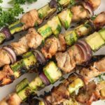 Chicken Zucchini Kabobs | Chicken Kabobs | Grill | Dinner Recipe | Chicken kabobs are a summertime grilling staple. Try these chicken zucchini kabobs for a healthy & delicious new way to enjoy chicken kabobs. Chicken chunks soak in a lemon-lime soda marinade and then get added to kabobs with zucchini and red onion. So simple and easy to make, perfect for a quick dinner! #chickenrecipes #easyrecipes #chickenkabobs
