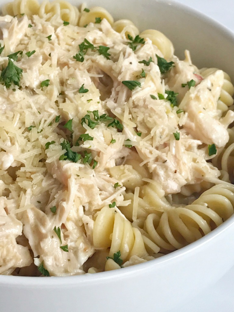 Slow cooker creamy Italian chicken is an easy and creamy delicious dinner. It's a dump & go slow cooker meal that takes just minutes to prepare and then it's ready when you are. The chicken is fall apart tender and it makes the most amazing creamy Italian sauce. Serve over pasta for a delicious dinner.