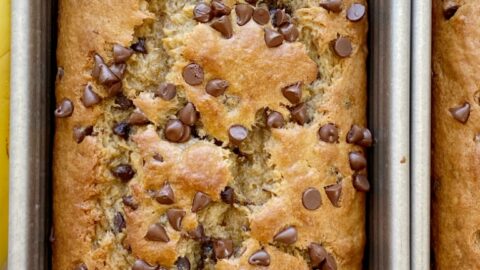 Banana Bread Recipe | Peanut Butter and Banana Recipes | Peanut Butter Chocolate Chip Banana Bread with creamy peanut butter, mashed bananas, chocolate chips, and applesauce to make it really moist and soft. Two bowls and no mixer needed for this quick bread recipe.