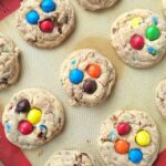 Thick, soft, chewy, melt-in-your-mouth delicious, and loaded with peanut butter m&m's. These peanut butter m&m cookies are sure to be a hit and I bet you that they won't last long!