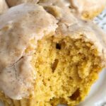 Pumpkin donut glazed muffins bake up perfectly and are so soft & fluffy. Full of pumpkin and pumpkin spices and then dipped in a delicious maple cinnamon glaze. 