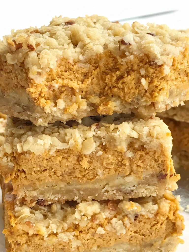 Pumpkin pie crumble bars tastes just like pumpkin pie but in bar form! A brown sugar, oat, pecan crumble with a sweet and creamy pumpkin cheesecake middle. These bars are one of our favorite pumpkin desserts. They are a must-make. 