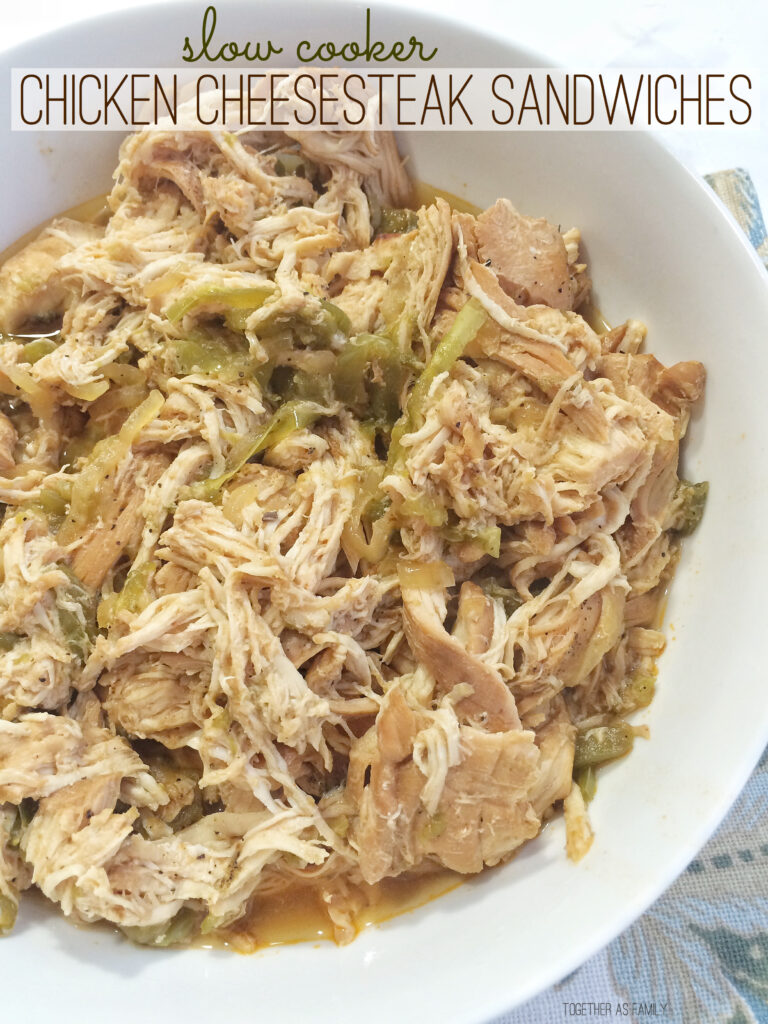 Shredded slow cooker chicken in white serving bowl