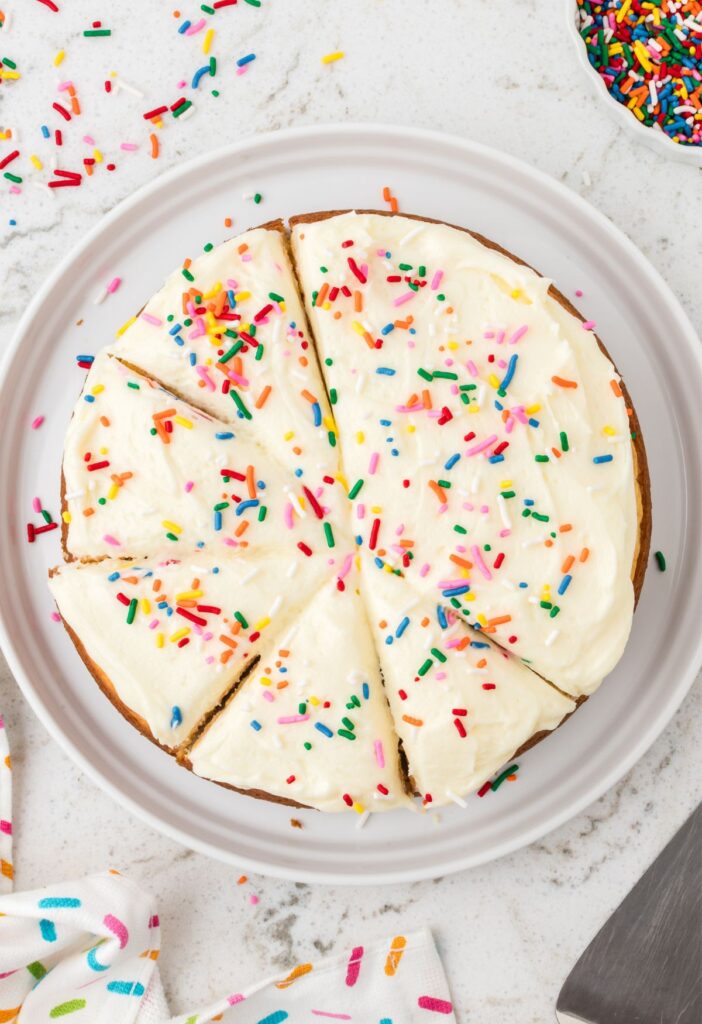 Hero image of the cake mix hack recipe for a round cake with frosting.