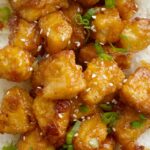 Homemade Baked Sweet & Sour Chicken is better than any take-out! Fresh and homemade with only a few ingredients. Chunks of crispy baked chicken in an easy sweet & sour sauce.