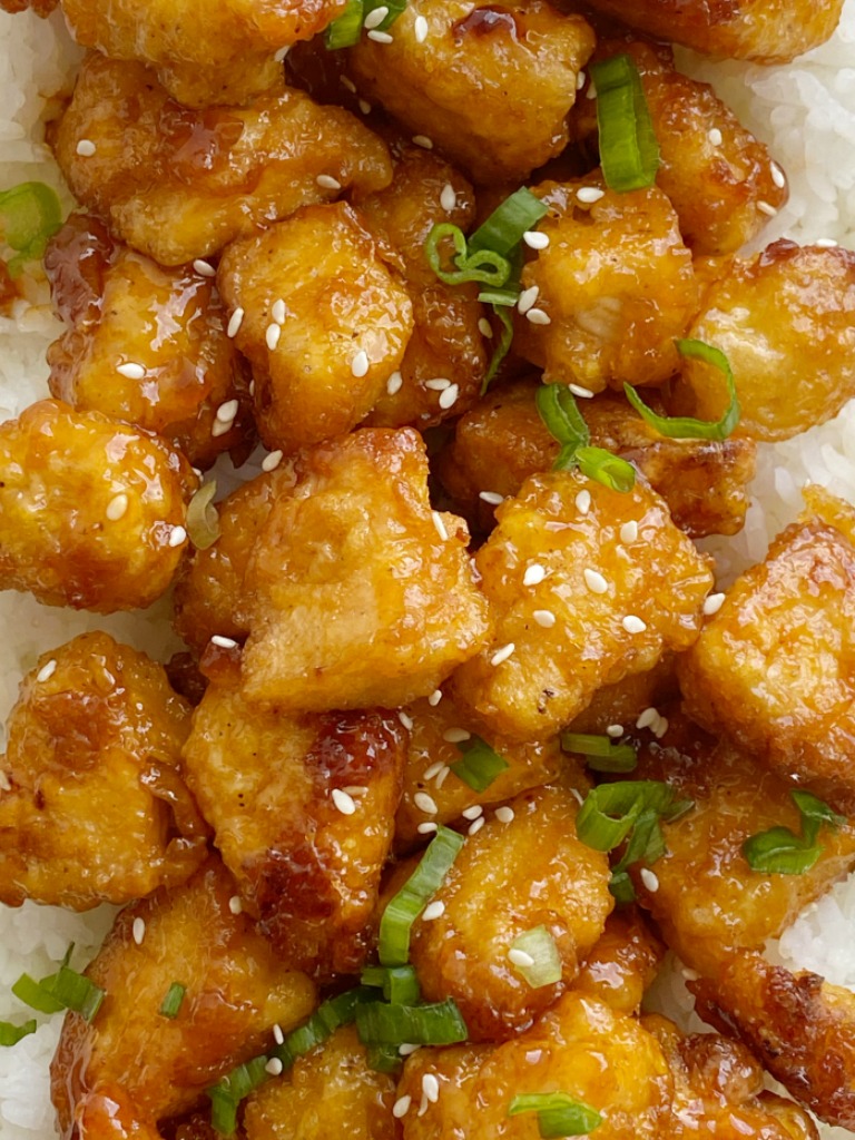 Homemade Baked Sweet & Sour Chicken is better than any take-out! Fresh and homemade with only a few ingredients. Chunks of crispy baked chicken in an easy sweet & sour sauce. 