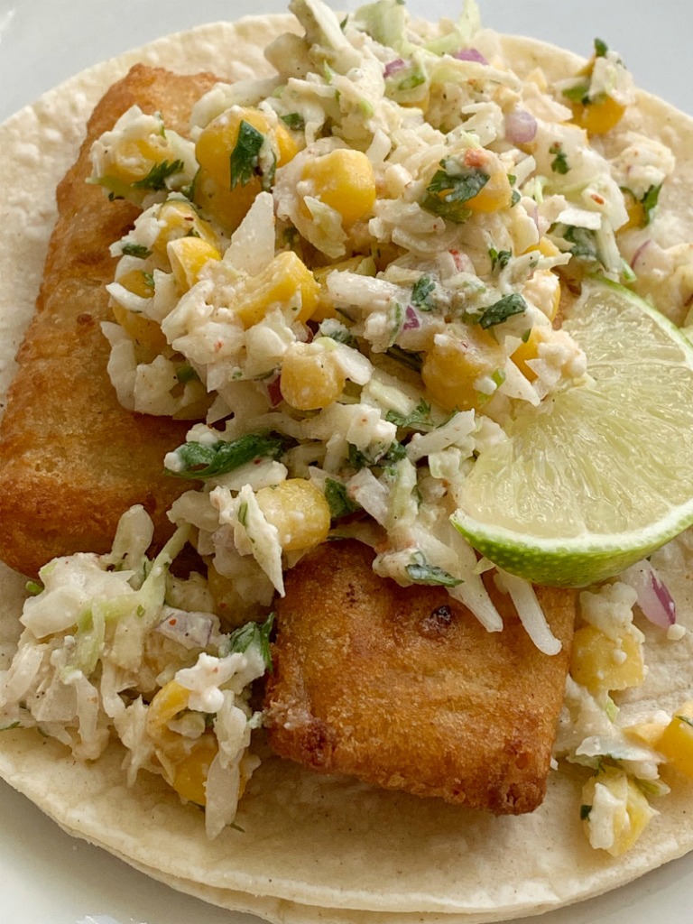 Easy Fish Tacos | Fish Taco Recipe | Easy Fish Tacos made with convenient frozen crispy fish sticks and a simple, 5 ingredient homemade cabbage slaw. Serve with corn tortillas for a simpler, and easier way to enjoy fish tacos. #fishtacos #easyrecipes #dinner #dinnerrecipes #tacos #tacorecipe 