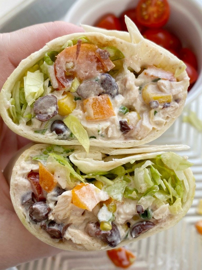 Santa Fe Chicken Salad Wraps have a creamy santa fe chicken salad wrapped inside a tortilla with shredded lettuce, tomato, and avocado slices. Perfect for lunch or a grab & go dinner for busy weeknights.