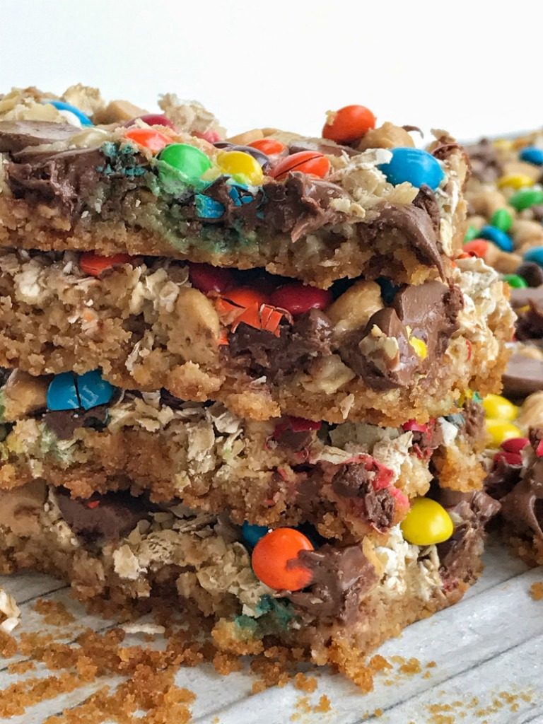 All the classic flavors you love in a monster cookie but in a magic cookie bar! These monster cookie magic bars have a salty sweet graham cracker crust and then loaded with oats, peanut butter chips, chocolate chips, m&m's and drizzled in sweetened condensed milk.