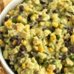 Avocado Dip is packed full with chunky avocados, corn, black beans, red onion, and salsa verde. So easy to make you only need 5 ingredients.