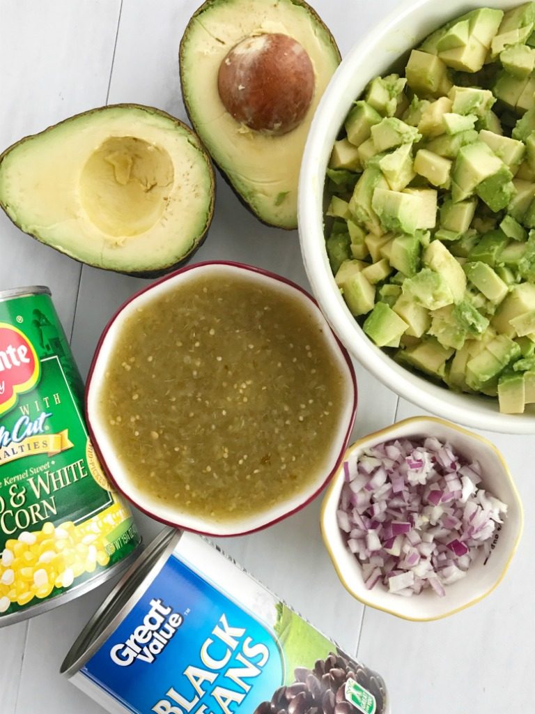 Avocado Dip | Appetizer | Dip | Dips with Avocados | Super Bowl Food | Party Food | Avocado dip is packed full with chunky avocados, corn, black beans, red onion and then drizzled with easy & convenient canned salsa verde. So much flavor with very little effort. Avocado dip is the best game day appetizer, chip dip, and party food | Together as Family #appetizerrecipes #appetizer #gamedaydips #gamedayappetizers #avocadodip #avocadodiprecipe #avocados