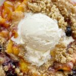 Peach Blueberry Crisp with fresh, juicy peaches & blueberries topped with a sweet buttery brown sugar crisp topping. Don't forget to serve with vanilla bean ice cream for an unforgettable fruit dessert.