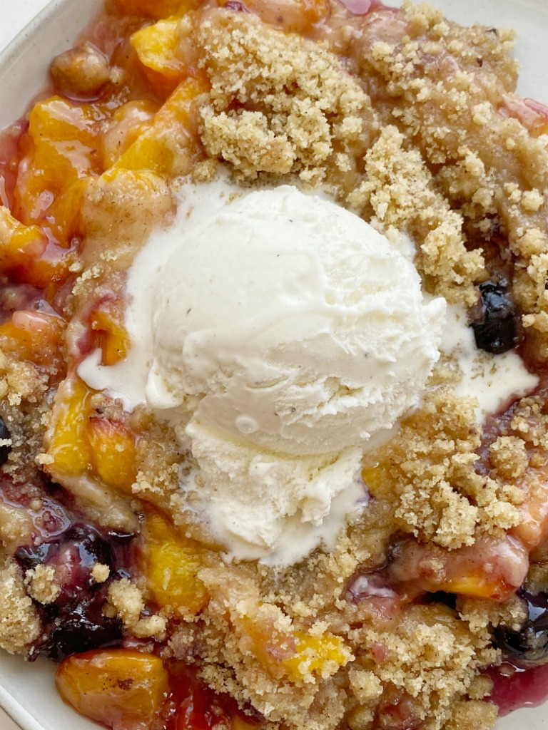 Peach Blueberry Crisp with fresh, juicy peaches & blueberries topped with a sweet buttery brown sugar crisp topping. Don't forget to serve with vanilla bean ice cream for an unforgettable fruit dessert. 