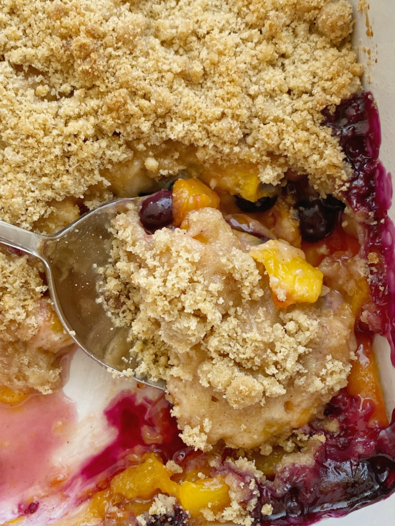 Peach Blueberry Crisp with fresh, juicy peaches & blueberries topped with a sweet buttery brown sugar crisp topping. Don't forget to serve with vanilla bean ice cream for an unforgettable fruit dessert. 
