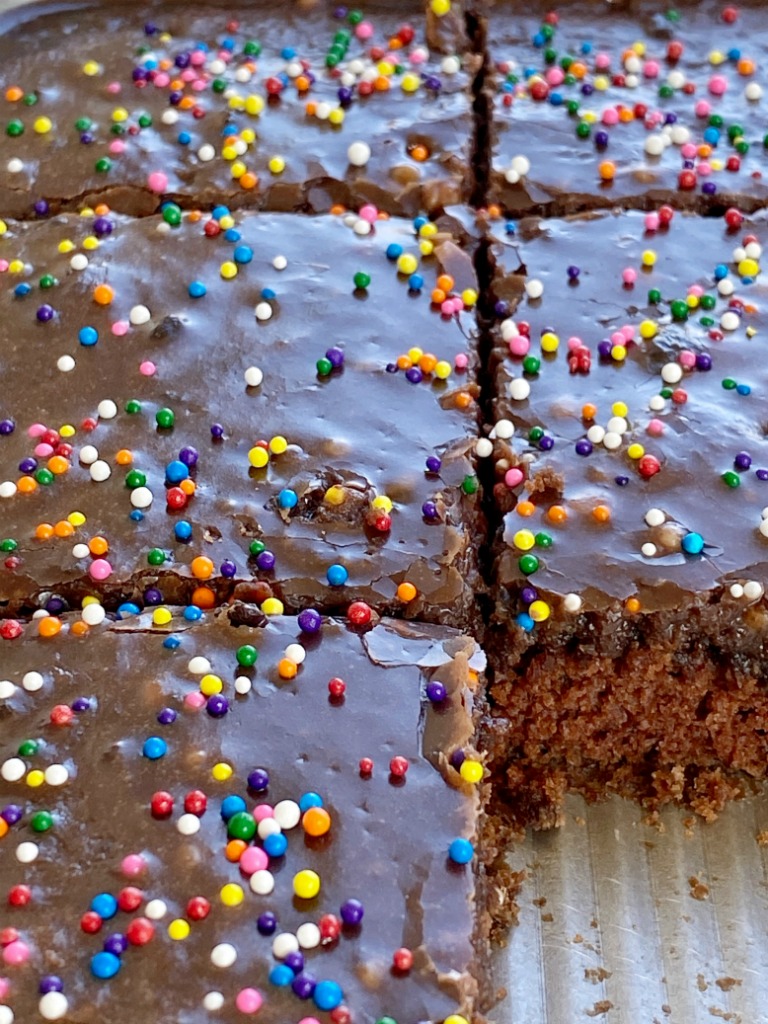 Chocolate Sheet Cake is a perfectly moist chocolate cake topped with a milk chocolate fudge frosting that just melts into the cake.