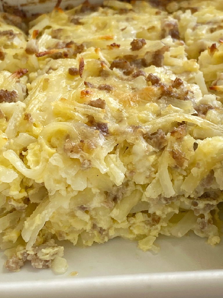 Breakfast Sausage Casserole is all your favorite breakfasts in one casserole! Shredded hash browns, fluffy eggs, cheese, and crumbled sausage. Serve as is or use it as filling for breakfast burritos topped with salsa and, sour cream, and cheese.