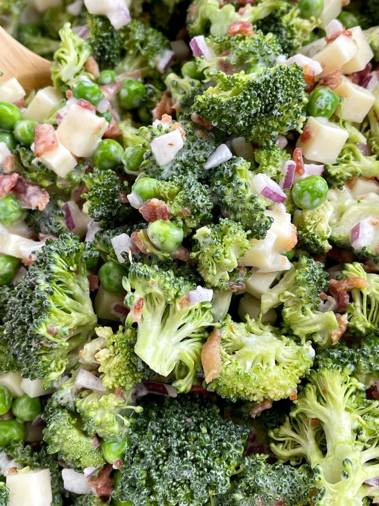 A picture of bacon broccoli salad inside a mixing bowl. 