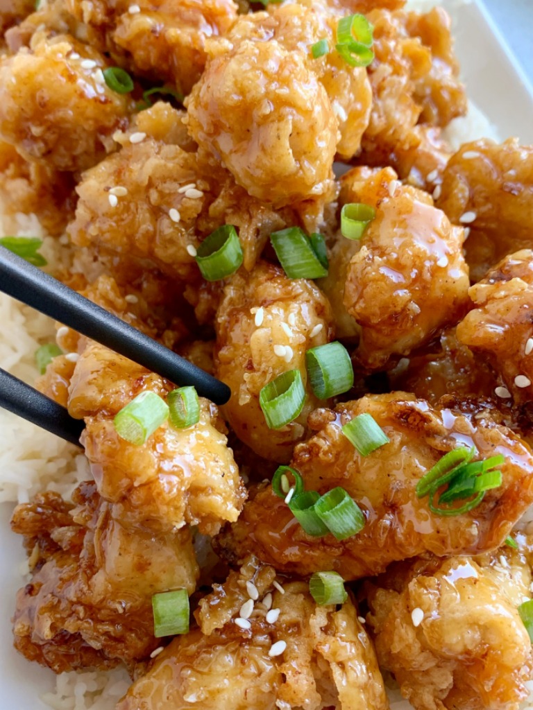 Honey Chicken has the crispiest, most delicious coating ever! Chunks of chicken dipped in seasoned flour & buttermilk, and then pan fried to crispy chicken perfection. Cover the crispy honey chicken in a sweet homemade honey sauce and serve over rice!