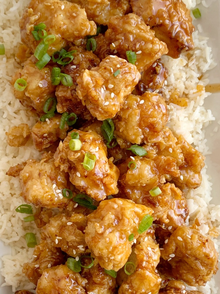 Honey Chicken has the crispiest, most delicious coating ever! Chunks of chicken dipped in seasoned flour & buttermilk, and then pan fried to crispy chicken perfection. Cover the crispy honey chicken in a sweet homemade honey sauce and serve over rice!