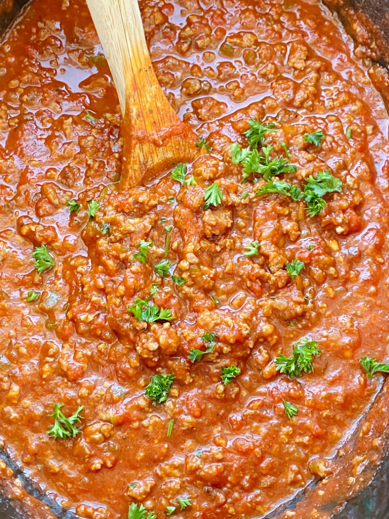 Come home to an Italian feast with this Slow Cooker ITALIAN SAUSAGE & BEEF SPAGHETTI SAUCE. Two meats simmer all day long in the crock pot for maximum flavor. Leftovers freeze really well for another pasta dinner night.