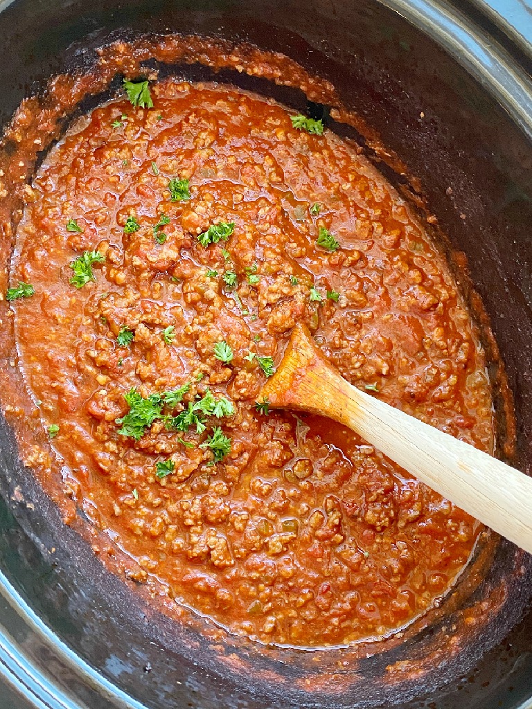 Come home to an Italian feast with this Slow Cooker ITALIAN SAUSAGE & BEEF SPAGHETTI SAUCE. Two meats simmer all day long in the crock pot for maximum flavor. Leftovers freeze really well for another pasta dinner night.