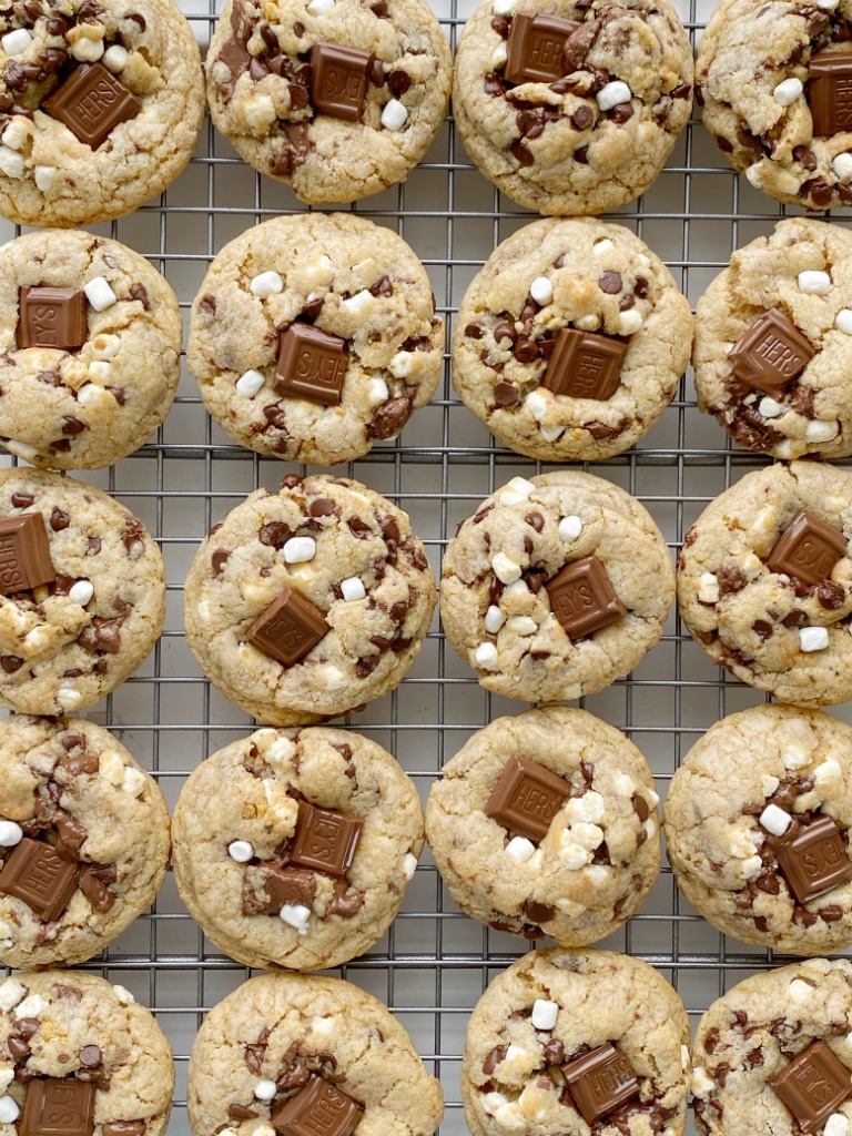 S'mores Dessert Recipes | Cookie Recipes | Smores Cookies are soft-baked, thick, and chewy. Graham cracker cookie dough base, marshmallow bits, Hershey's chocolate, and chocolate chips. 