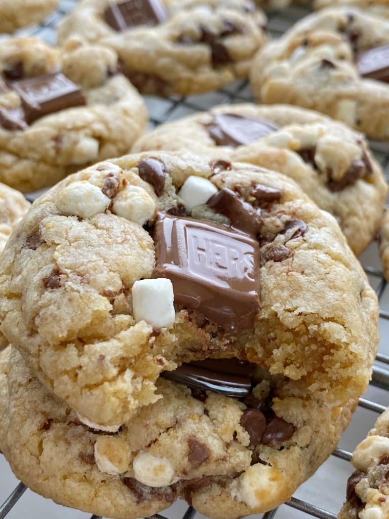 S'mores Dessert Recipes | Cookie Recipes | Smores Cookies are soft-baked, thick, and chewy. Graham cracker cookie dough base, marshmallow bits, Hershey's chocolate, and chocolate chips. 