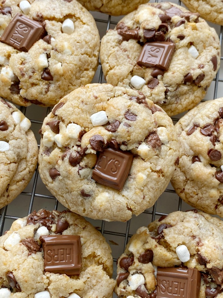 S'mores Dessert Recipes | Cookie Recipes | Smores Cookies are soft-baked, thick, and chewy. Graham cracker cookie dough base, marshmallow bits, Hershey's chocolate, and chocolate chips.