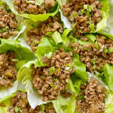 These Chicken Lettuce Wraps taste just like the ones from the famous P.F Changs restaurant. Ground chicken, sesame oil, garlic, ginger, hoisin sauce, water chestnuts, and a touch of brown sugar and hot sauce. Serve with some bib lettuce for the best ground chicken lettuce wrap.