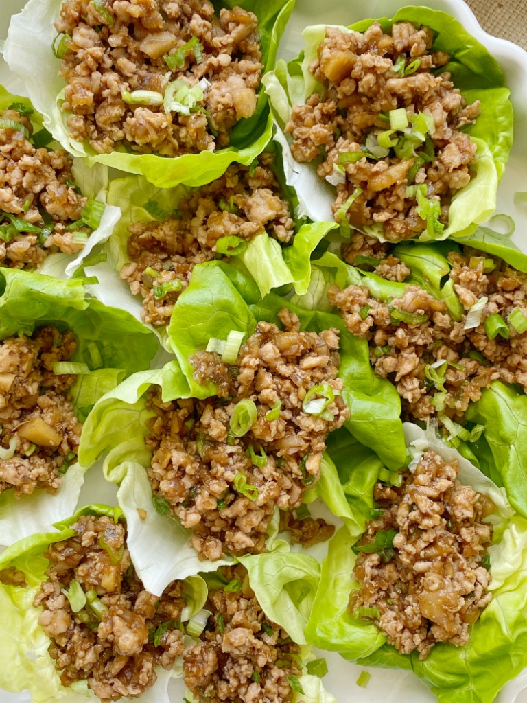 These Chicken Lettuce Wraps taste just like the ones from the famous P.F Changs restaurant. Ground chicken, sesame oil, garlic, ginger, hoisin sauce, water chestnuts, and a touch of brown sugar and hot sauce. Serve with some bib lettuce for the best ground chicken lettuce wrap.
