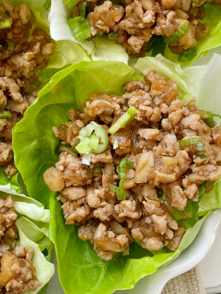 These Chicken Lettuce Wraps taste just like the ones from the famous P.F Changs restaurant. Ground chicken, sesame oil, garlic, ginger, hoisin sauce, water chestnuts, and a touch of brown sugar and hot sauce. Serve with some bib lettuce for the best ground chicken lettuce wrap. 