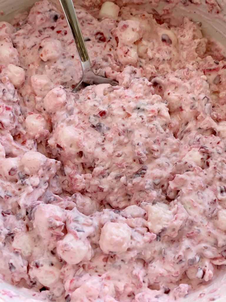 Cranberry Fluff is full of Fresh cranberries, crushed pineapple, heavy cream, and cream cheese. Cranberry fluff is so light, fluffy, sweet, tart, and the perfect mix of textures for a side dish at Thanksgiving dinner. 