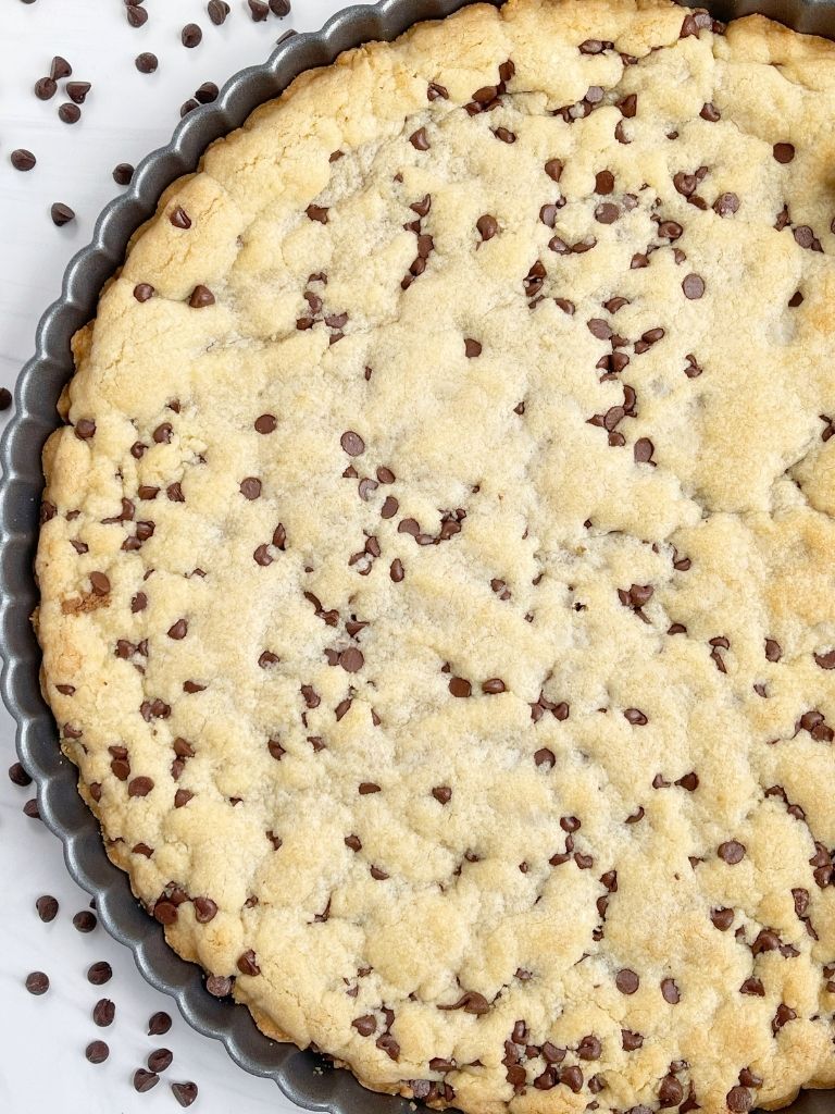 A big chocolate chip cookie made in a tart pan.