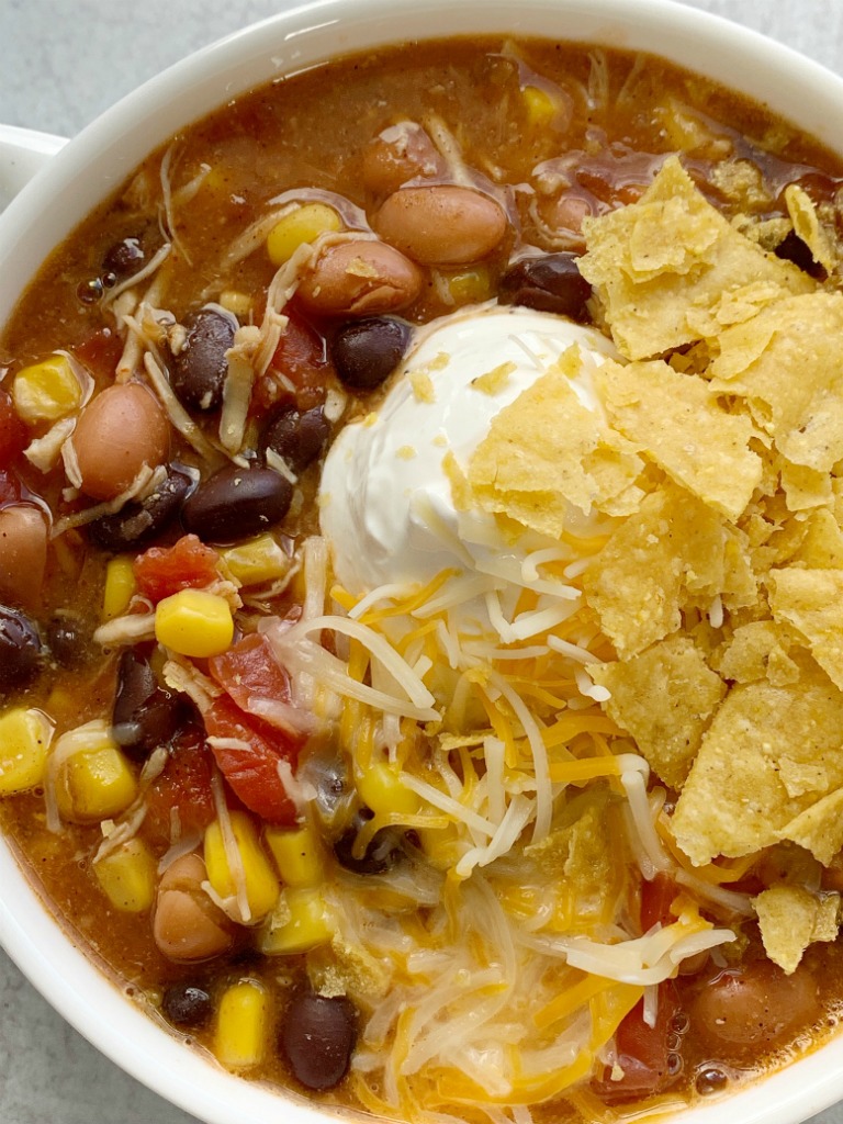 7 Can Chicken Taco Soup | 7 Can Soup Recipe | Soup Recipe | Dinner does not get any easier than this 7 can chicken taco soup! Dump 7 cans into a pot plus some seasonings and that's it! Serve with tortilla chips, cheese, and sour cream. You won't believe how yummy & easy it is.