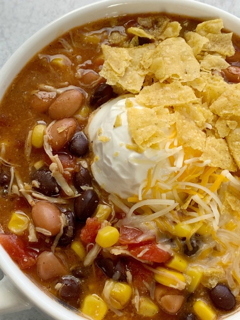 7 Can Chicken Taco Soup | 7 Can Soup Recipe | Soup Recipe | Dinner does not get any easier than this 7 can chicken taco soup! Dump 7 cans into a pot plus some seasonings and that's it! Serve with tortilla chips, cheese, and sour cream. You won't believe how yummy & easy it is.