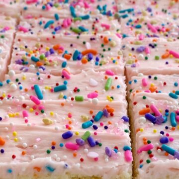 Sugar Cookie Bars | Sugar Cookie Bars are thick, soft-baked and topped with the best cream cheese frosting! Sugar cookie bars bake in a cookie sheet so there is plenty serve a crowd. Change up the frosting color and sprinkles for any event or Holiday.