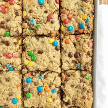 No Flour Monster Cookie Bars are loaded with oats, peanut butter, chocolate chips, and m&m's. They bake in a cookie sheet and make enough to feed a crowd. Plus, there is no flour in them!